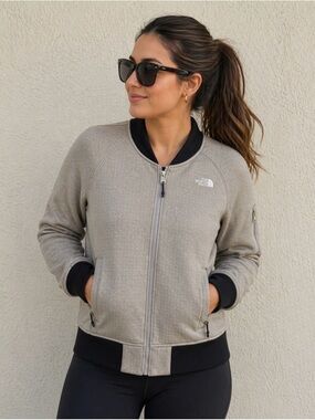 The North Face Kelana women’s bomber jacket, tan/gray with black cuffs. Size M.